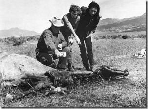 (Original Caption) Mr. Duane Martin, forestry aid makes radiological test of Snippy the horse believed by the horse's owner Mrs. Berle Lewis (c) to have died under mysterious circumstances. Indication of radiation was located. Mrs. Leona Wellington (r), a school teacher, looks on.