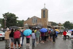 Queue to view Virgin Mary on cross