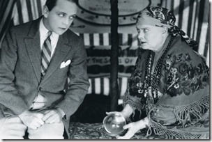 man-has-his-fortune-told-by-gypsy-with-a-crystal-ball