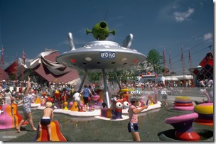 Children play on brightly colored playground equipment that sprays water at the 1986 World's Fair in Vancouver, British Columbia. A statue of a flying saucer above the playground has the liscense plate "UFO-H2O". (Photo by ?? Philip James Corwin/CORBIS/Corbis via Getty Images)