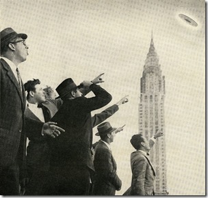 crowd-points-to-a-ufo-flying-over-the-chrysler-building-in-news-photo-1642625822
