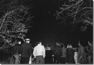 (Original Caption) 3/21/66-Dexter,Michigan- With unidentified flying objects reportedly frequenting the southern Michigan area, curious citizens are turning out by the hundreds to scan the night sky. These area residents gathered late at the scene of a reported sighting by Dexter patrolman Robert Huniwell 3/20. The latest reported sighting was from Hinsdale Michigan, when an unidentified object was watched for several hours by Hinsdale County Civil Defense Director William Van Horn and 87 co-eds from Hinsdale College.