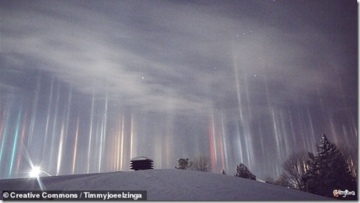 39166070-9249429-Pictured_Light_pillars_seen_over_over_North_Bay_Ontario_caused_b-a-47_1613049969855