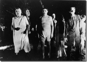 A line of undead 'zombies' walk through a field in the night in a still from the film, 'Night Of The Living Dead,' directed by George Romero, 1968. (Photo by Pictorial Parade/Getty Images) 