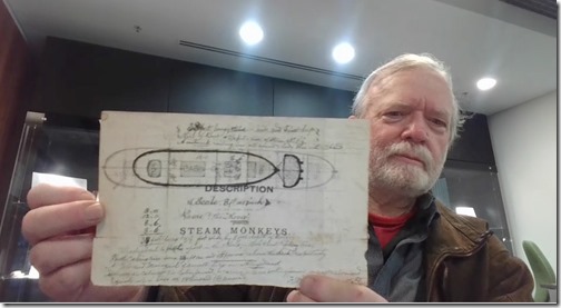 Bill Chalker in the Sydney University library rare materials room 2 August 2024 holding Birmingham's Rover flying machine drawing